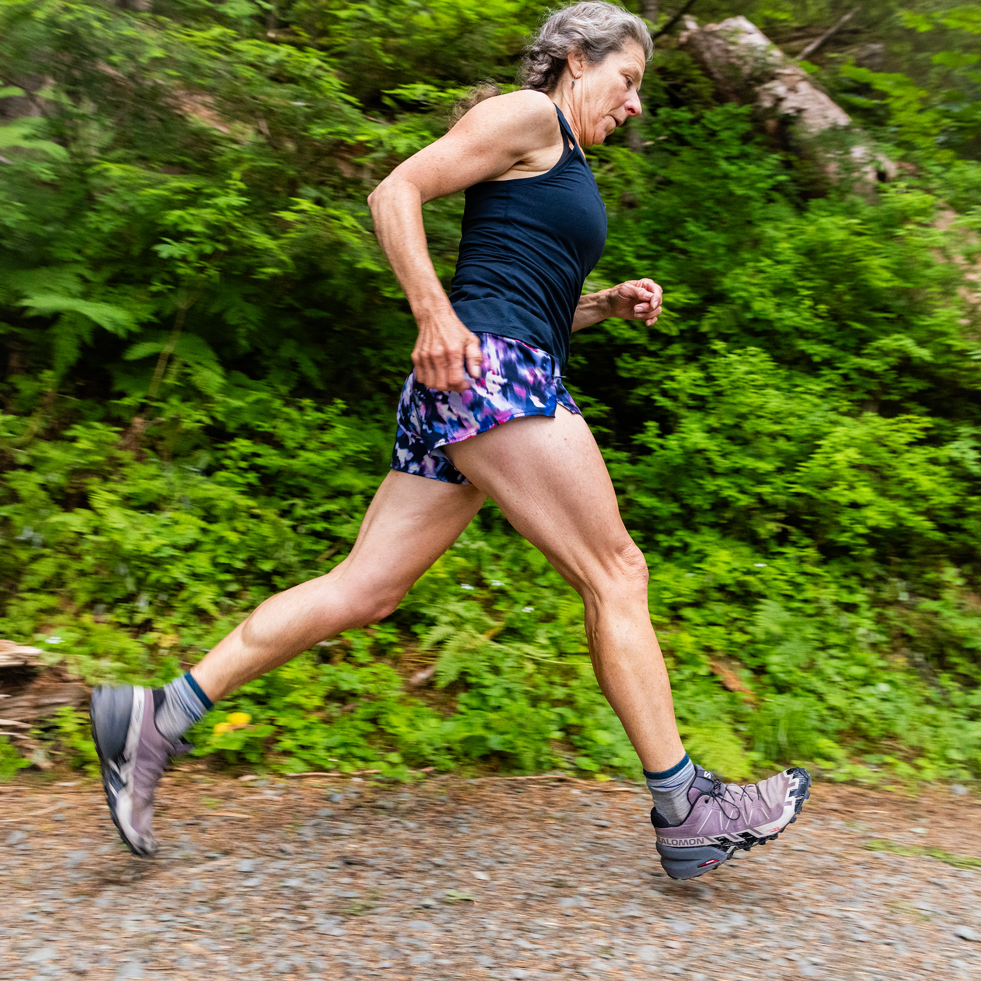 Trail runner on a wooded path