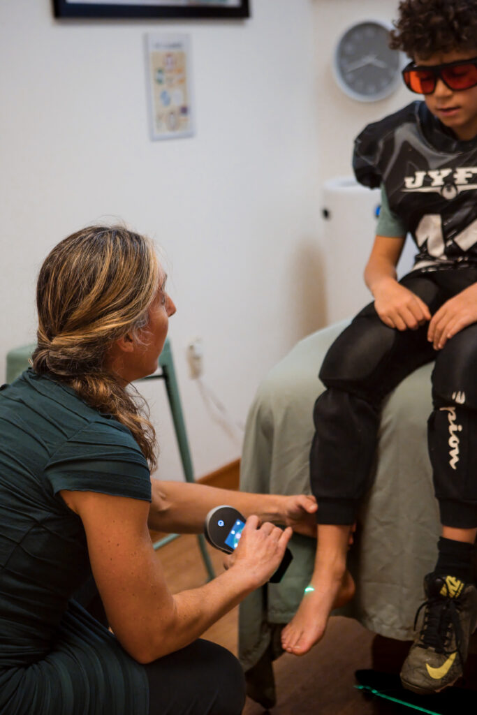 Kid receiving care for a football injury.