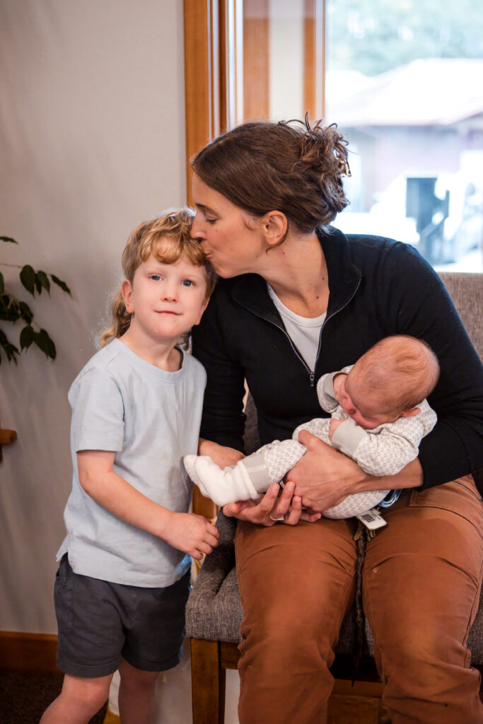 Mother holding her baby during a visit at Alpine Integrative Acupuncture in Juneau, Alaska